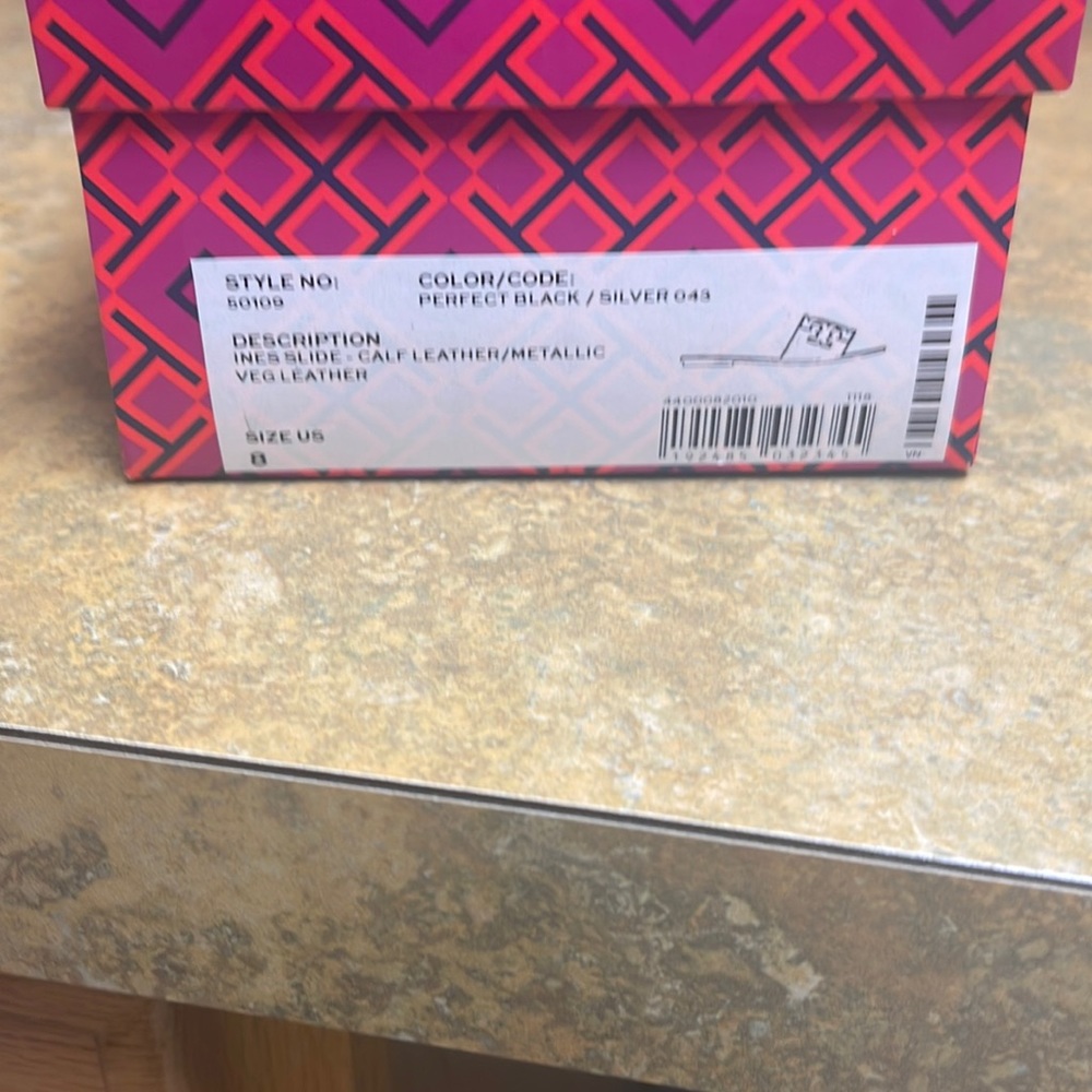 Tory Burch size 8 , brand new never worn black and silver leather , ines slide